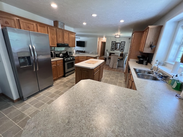 260 Treml, Michigan, MI 49411 - kitchen featuring stainless steel appliances, a peninsula, recessed lighting, a kitchen island, and light countertops