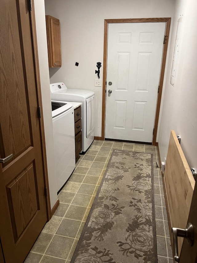 260 Treml, Michigan, MI 49411 - washroom featuring separate washer and dryer, cabinet space, and tile patterned flooring