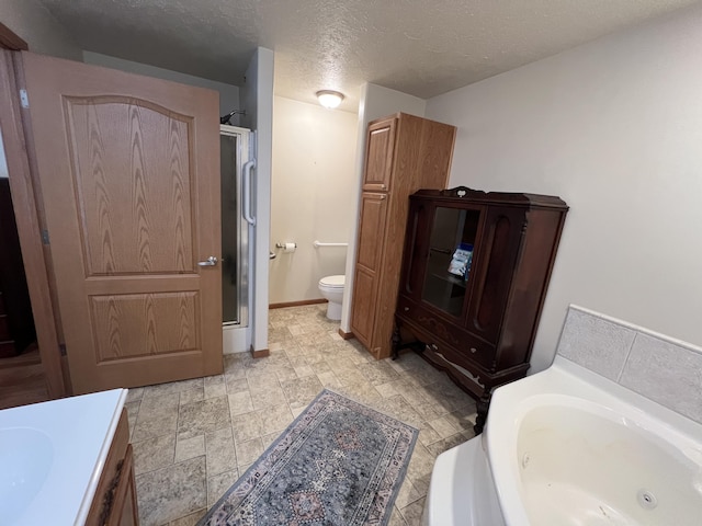 260 Treml, Michigan, MI 49411 - bathroom with a shower stall, a jetted tub, a textured ceiling, and vanity