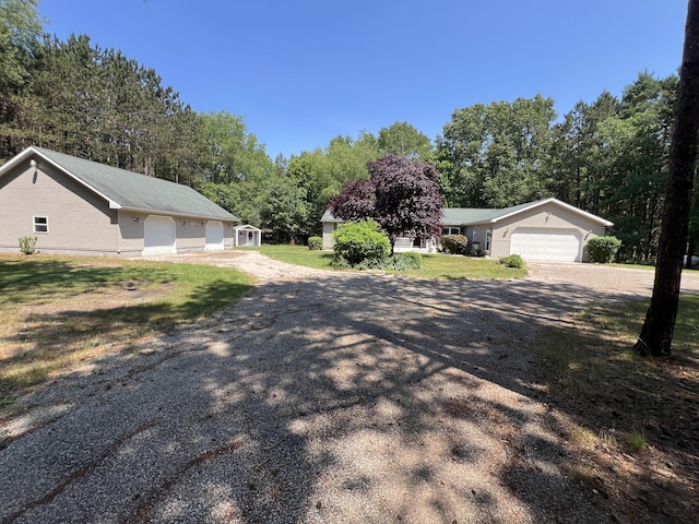 260 Treml, Michigan, MI 49411 - view of dirt / gravel road with view of wooded area