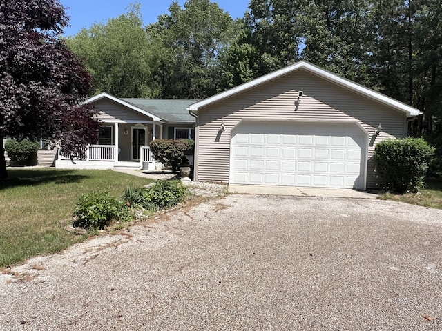 260 Treml, Michigan, MI 49411 - ranch-style home with covered porch, a front yard, and driveway