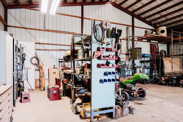 2098 Fisher Ct, Howell, MI 48855 - garage featuring a workshop area and metal wall