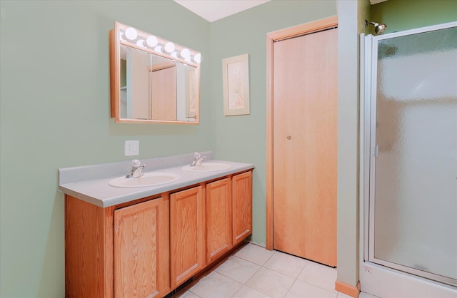2098 Fisher Ct, Howell, MI 48855 - bathroom featuring a stall shower, double vanity, and tile patterned flooring