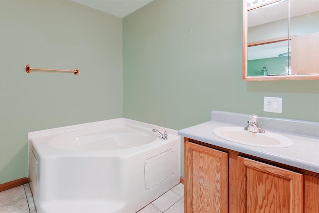 2098 Fisher Ct, Howell, MI 48855 - bathroom with tile patterned floors, vanity, and a bath
