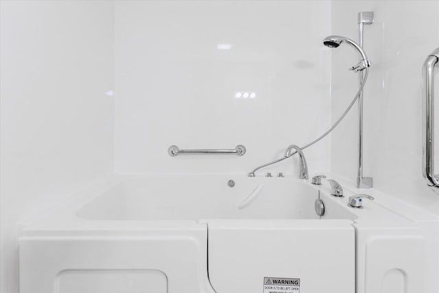 2098 Fisher Ct, Howell, MI 48855 - bathroom featuring a tub to relax in