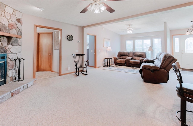 2098 Fisher Ct, Howell, MI 48855 - living area featuring carpet, ceiling fan, and a fireplace