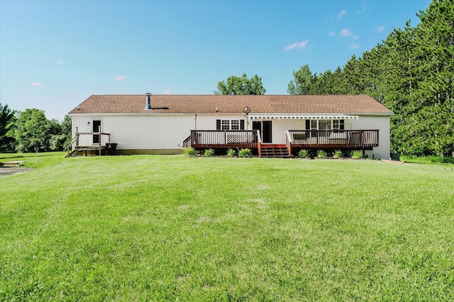 2098 Fisher Ct, Howell, MI 48855 - rear view of house with a wooden deck and a yard