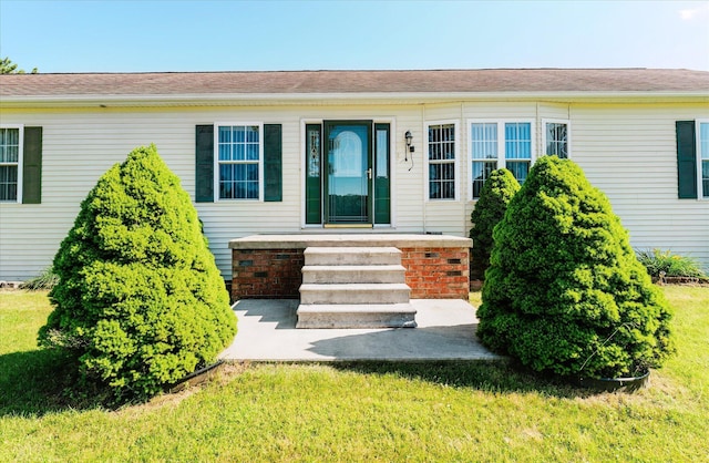 2098 Fisher Ct, Howell, MI 48855 - entrance to property featuring a lawn