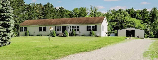 2098 Fisher Ct, Howell, MI 48855 - view of front of home with an outdoor structure and a front lawn