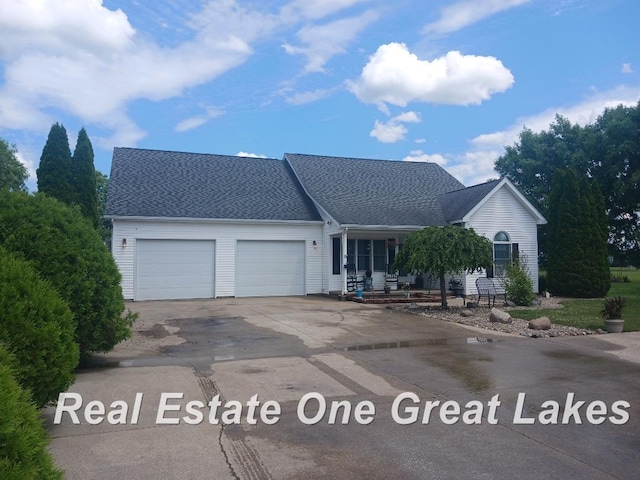 11347 Carr Rd, Saint Charles, MI 48655 - view of front facade with concrete driveway, an attached garage, and roof with shingles