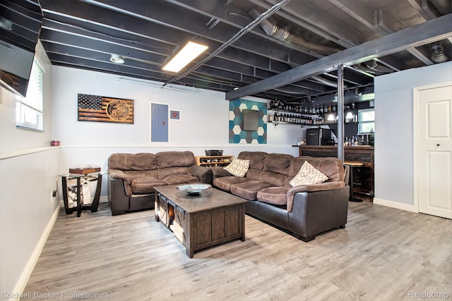 5885 Rockcroft Blvd, Clarkston, MI 48346 - living area with electric panel, a bar, wood finished floors, and healthy amount of natural light