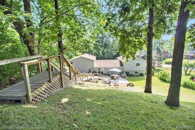 5885 Rockcroft Blvd, Clarkston, MI 48346 - view of grassy yard featuring stairway and a wooden deck