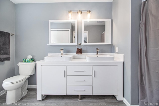 5885 Rockcroft Blvd, Clarkston, MI 48346 - full bathroom featuring wood finished floors and double vanity