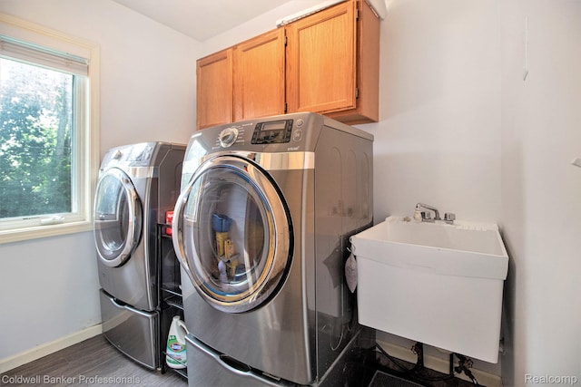 5885 Rockcroft Blvd, Clarkston, MI 48346 - laundry room with separate washer and dryer, cabinet space, and wood finished floors