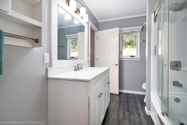 5885 Rockcroft Blvd, Clarkston, MI 48346 - bathroom featuring vanity, wood finished floors, and shower / bath combination with glass door