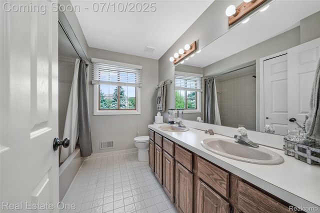 21653 Heatheridge Ln, Northville, MI 48167 - bathroom featuring double vanity, tile patterned flooring, and shower / bath combo with shower curtain