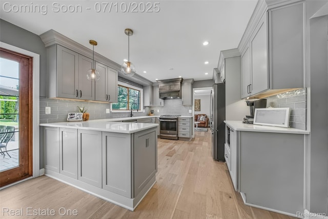 21653 Heatheridge Ln, Northville, MI 48167 - kitchen featuring gray cabinets, stainless steel appliances, a peninsula, light wood-style flooring, and recessed lighting