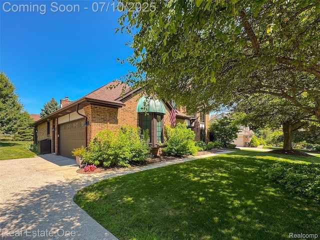 21653 Heatheridge Ln, Northville, MI 48167 - view of front of home featuring brick siding, a chimney, a front yard, an attached garage, and concrete driveway
