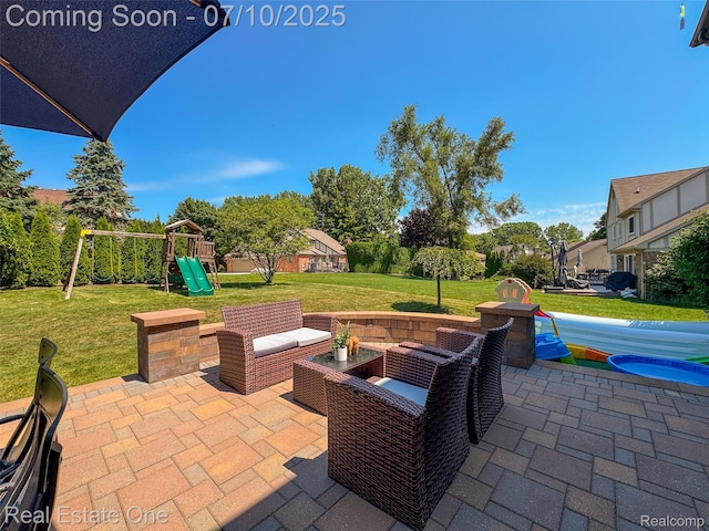 21653 Heatheridge Ln, Northville, MI 48167 - view of patio / terrace with a playground and an outdoor hangout area