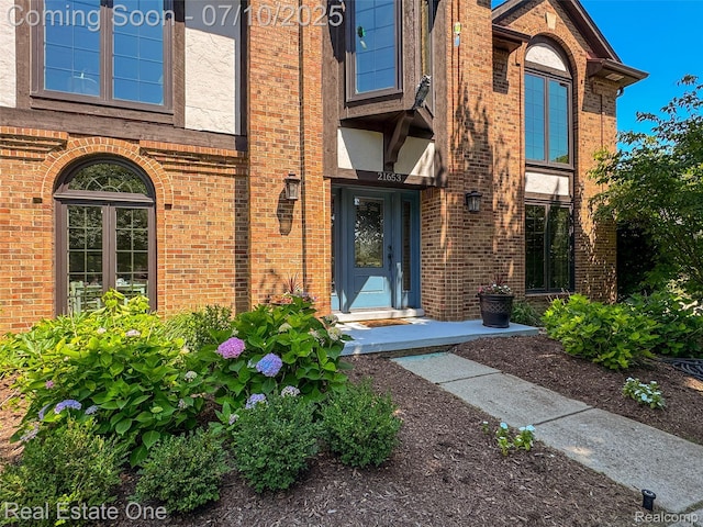 21653 Heatheridge Ln, Northville, MI 48167 - view of exterior entry with brick siding