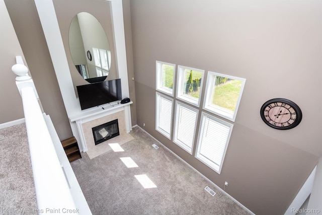 55856 Serene Dr, Macomb, MI 48042 - carpeted living room with a fireplace and a high ceiling