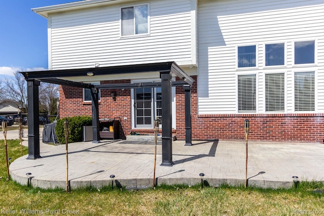 55856 Serene Dr, Macomb, MI 48042 - rear view of property with brick siding and a patio area