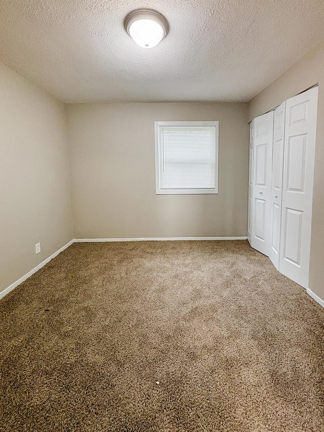 32013 Ottawa St, Westland, MI 48186 - unfurnished bedroom with carpet flooring, a textured ceiling, and a closet