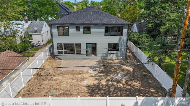 1978 Henrietta St, West Bloomfield, MI 48009 - rear view of house featuring a fenced backyard, a patio, and roof with shingles