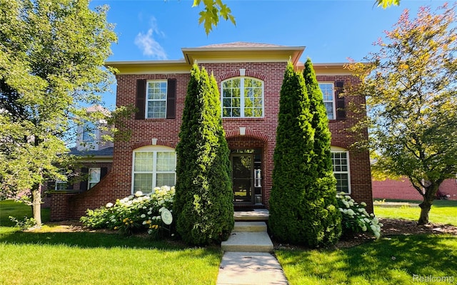 50042 Black Horse Ln, Canton, MI 48188 - colonial house featuring brick siding and a front yard