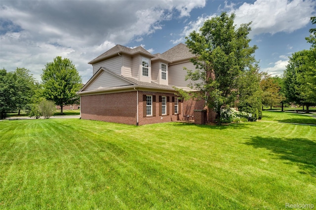 50042 Black Horse Ln, Canton, MI 48188 - back of house with brick siding and a lawn