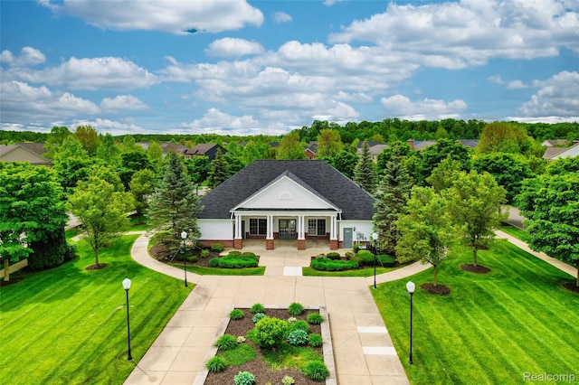 50042 Black Horse Ln, Canton, MI 48188 - view of front of house with a porch, a shingled roof, and a front lawn
