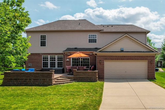 50042 Black Horse Ln, Canton, MI 48188 - back of property featuring a yard, concrete driveway, brick siding, a garage, and an outdoor living space
