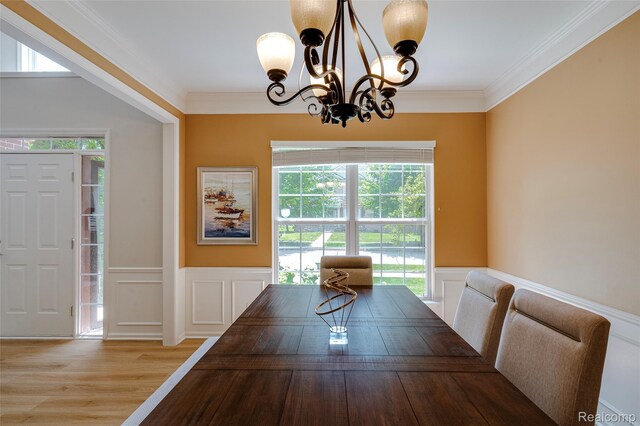 50042 Black Horse Ln, Canton, MI 48188 - dining room with a chandelier, a decorative wall, wood finished floors, a wainscoted wall, and ornamental molding