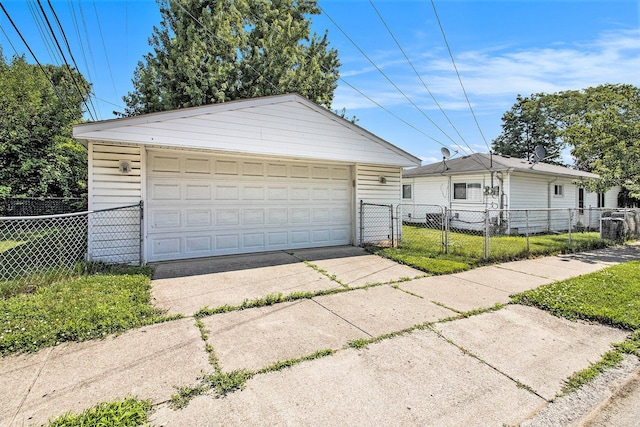 19263 Roger St, Melvindale, MI 48122 - view of front of home with a detached garage, an outdoor structure, and a gate