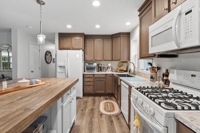 08311 W Shore Dr, Grand Junction, MI 49056 - kitchen featuring white appliances, wood counters, light wood-style floors, recessed lighting, and decorative light fixtures