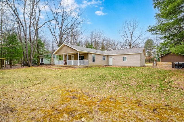 08311 W Shore Dr, Grand Junction, MI 49056 - rear view of house with a lawn and covered porch