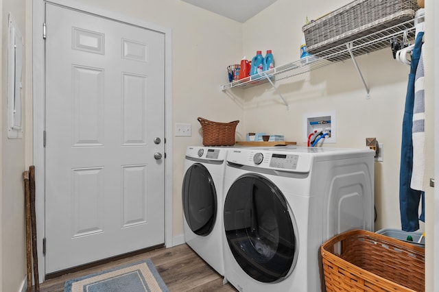08311 W Shore Dr, Grand Junction, MI 49056 - laundry area featuring separate washer and dryer and wood finished floors