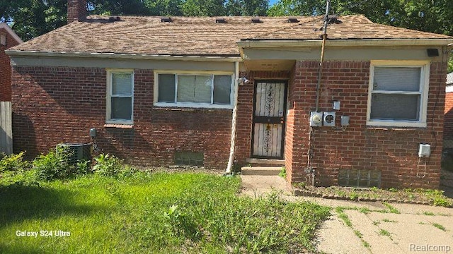 22784 N Kane, Detroit, MI 48223 - view of front facade featuring brick siding and a shingled roof