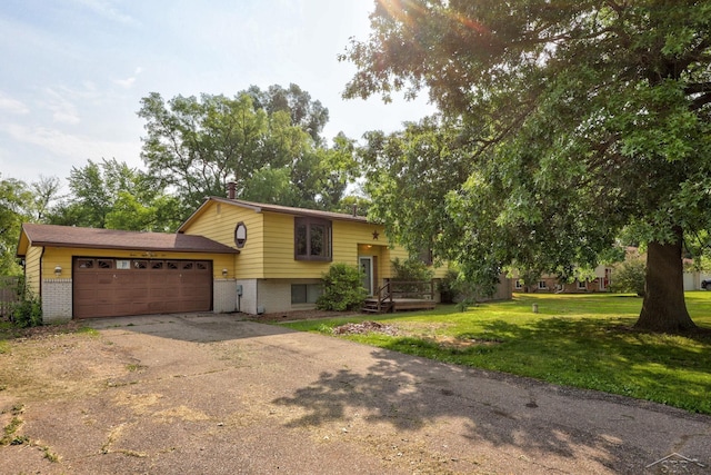 12821 Cimarron Dr, Birch Run, MI 48415 - view of front of house with brick siding, a garage, concrete driveway, and a front lawn