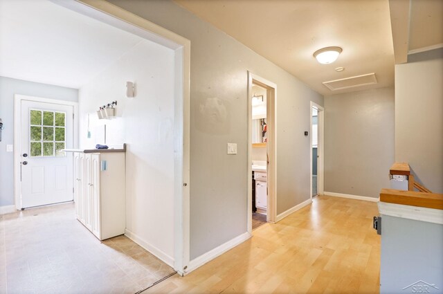12821 Cimarron Dr, Birch Run, MI 48415 - corridor featuring attic access and light wood-style flooring
