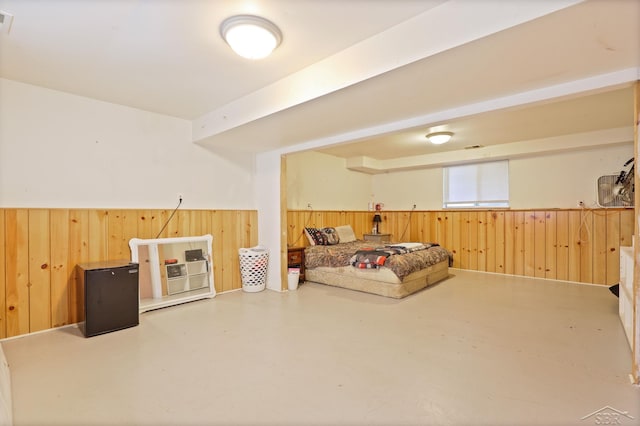 12821 Cimarron Dr, Birch Run, MI 48415 - sitting room with wood walls, a wainscoted wall, and finished concrete floors