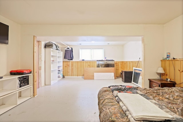 12821 Cimarron Dr, Birch Run, MI 48415 - bedroom featuring finished concrete flooring and wood walls