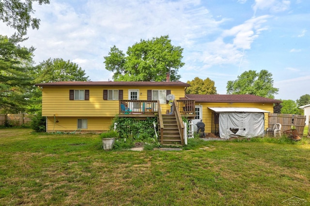 12821 Cimarron Dr, Birch Run, MI 48415 - rear view of house featuring stairway, a deck, and a chimney