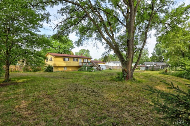 12821 Cimarron Dr, Birch Run, MI 48415 - view of yard with a deck and stairs