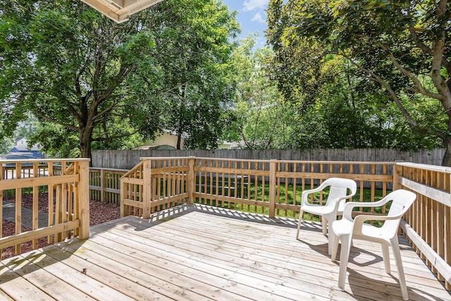 100 4th Ave, Tawas City, MI 48763 - wooden terrace with a fenced backyard