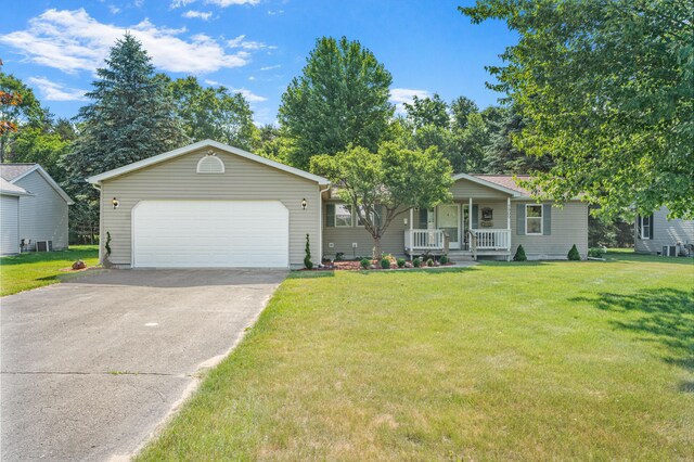 7900 Sunset Shores Dr, Canadian Lakes, MI 49346 - view of front facade featuring a porch, a front lawn, and driveway