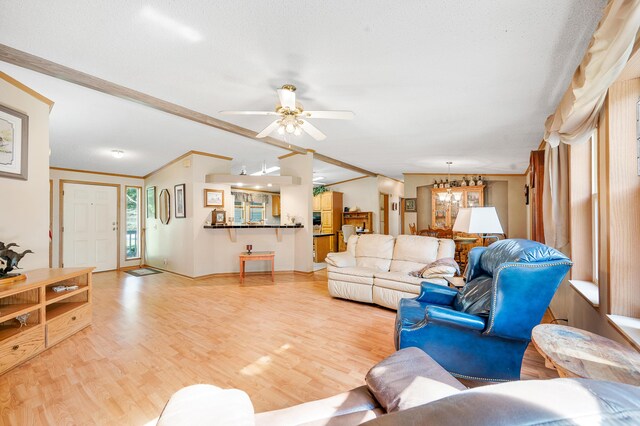 7900 Sunset Shores Dr, Canadian Lakes, MI 49346 - living area with light wood finished floors, a chandelier, and a ceiling fan