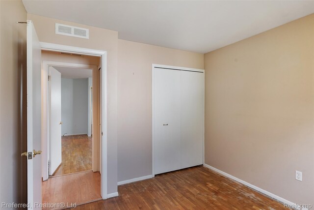 839 Judith St, Westland, MI 48186 - unfurnished bedroom featuring wood finished floors and a closet