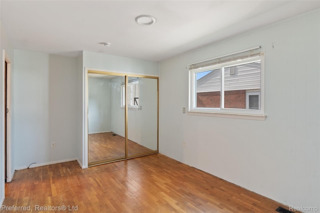 839 Judith St, Westland, MI 48186 - unfurnished bedroom with light wood-style floors and a closet