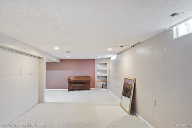 839 Judith St, Westland, MI 48186 - below grade area featuring light carpet, a textured ceiling, and recessed lighting